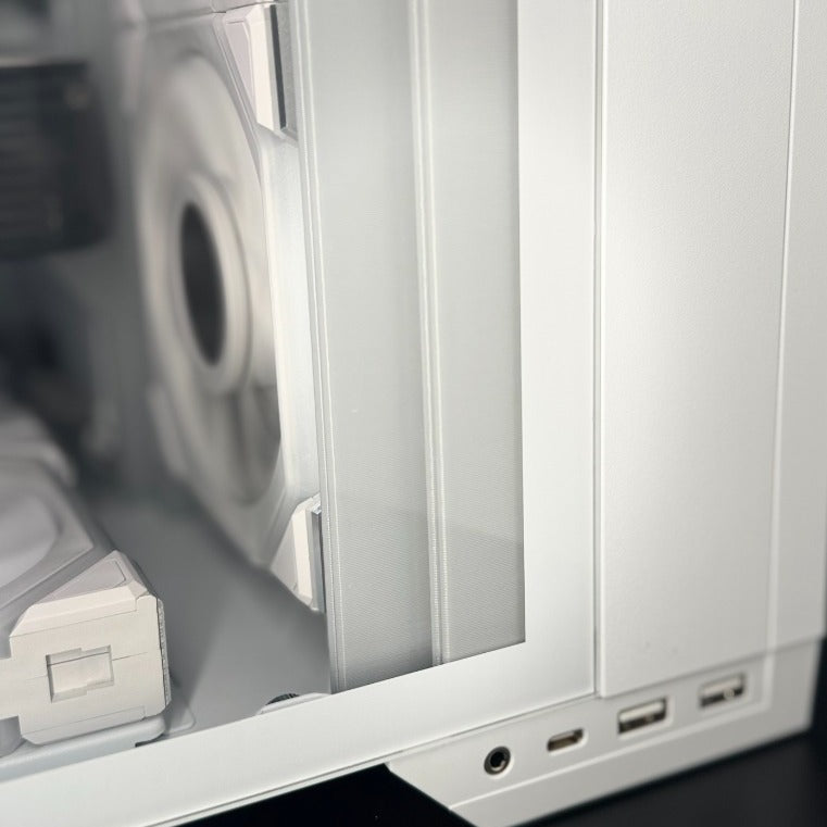Close-up of the bottom of the Redux Insert Kit above the O11 Vision Compact's front ports